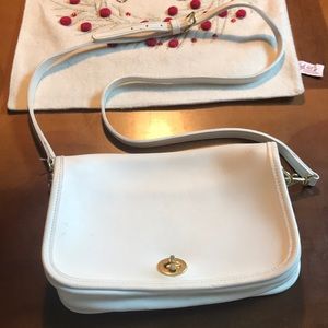 White coach crossbody or clutch. Removable strap.